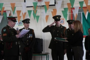 Ms. Dalton receiving our national flag from members of the Defence Forces.